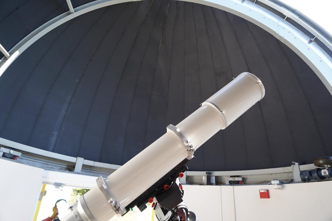 telescope pointing upwards toward observatory