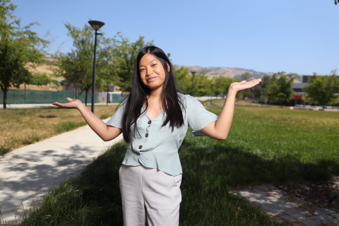 Girl with hand up in the air