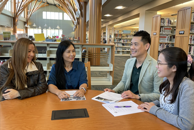 4 people sitting at a table