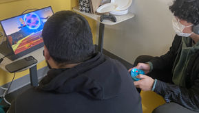 Two students playing video game