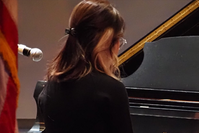 Female student playing the Piano