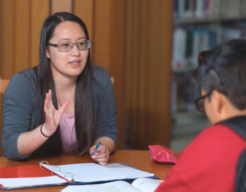 A school advisor speaks with a student.